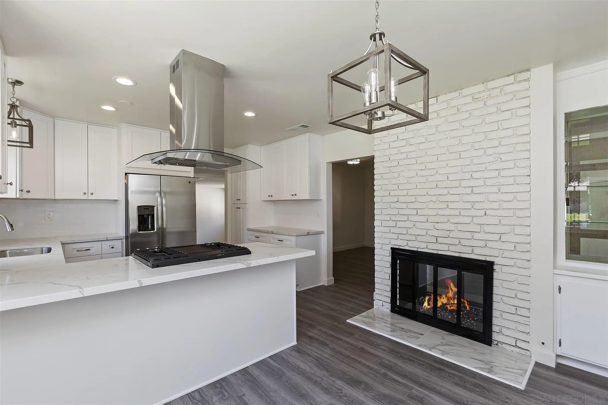 2956 Ronald Street Riverside, CA 92506 - Photo 8 of 28 a kitchen with stainless steel appliances granite countertop a stove top oven a sink and a counter space
