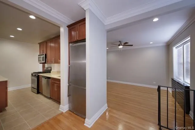 a kitchen with a refrigerator and a sink