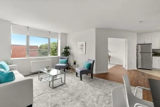 a living room with furniture and a window