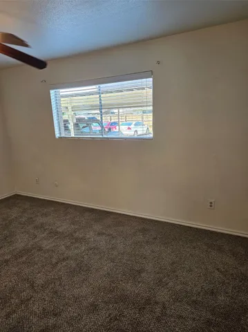 a view of a room with a sink and cabinets