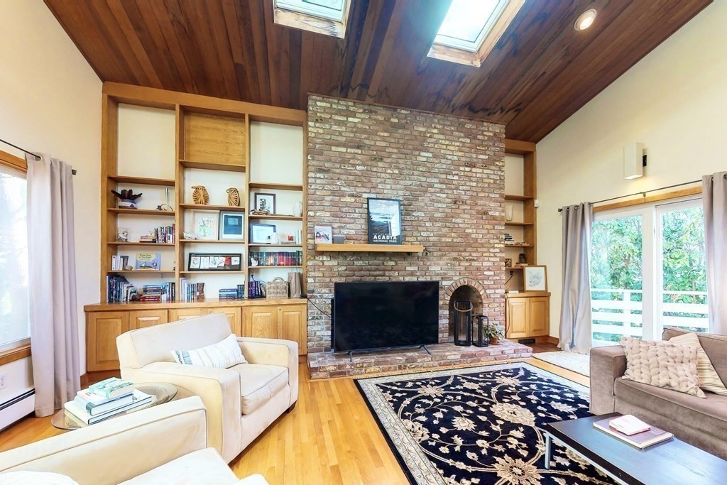 5 Spring Valley Road Belmont, MA 02478 - Photo 3 of 40 a living room with furniture and a fireplace