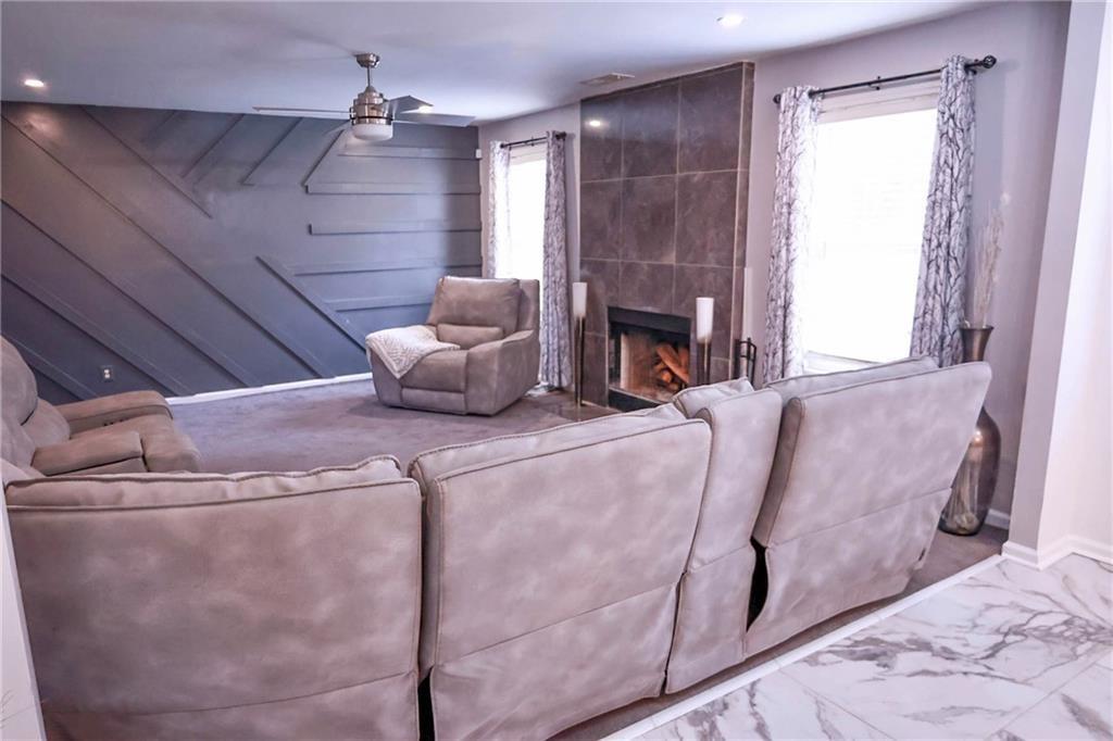 5964 Springfair Run Lithonia, GA 30038 - Photo 14 of 40 a bed room with a bed and a fireplace