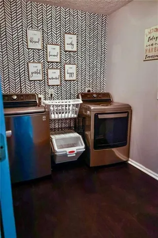 a view of a livingroom with furniture and a window