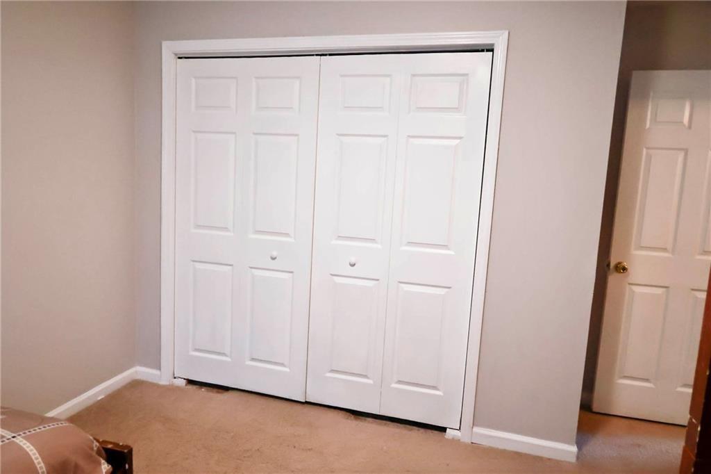 5964 Springfair Run Lithonia, GA 30038 - Photo 25 of 40 an empty room with wooden floor