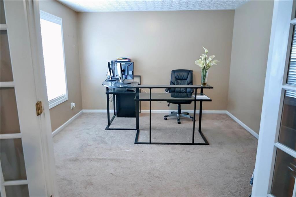 5964 Springfair Run Lithonia, GA 30038 - Photo 27 of 40 a view of a workspace with furniture