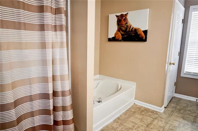 a bathroom with a sink vanity and a mirror