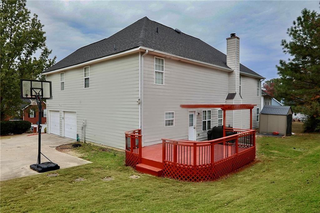 5964 Springfair Run Lithonia, GA 30038 - Photo 36 of 40 a front view of a house with yard