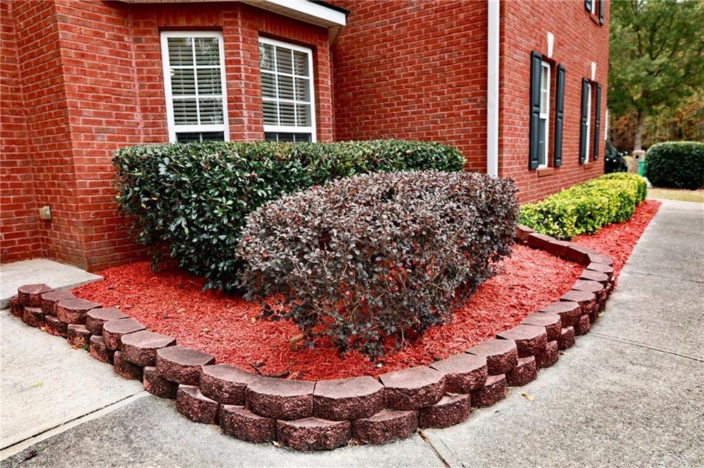 5964 Springfair Run Lithonia, GA 30038 - Photo 39 of 40 a view of a backyard with potted plants
