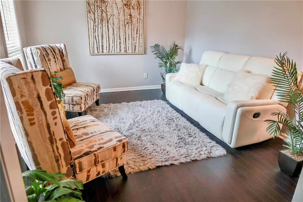 5964 Springfair Run Lithonia, GA 30038 - Photo 7 of 40 a living room with furniture and a window