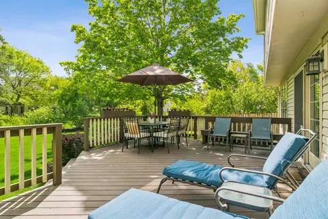 a view of balcony with outdoor seating and wooden floor