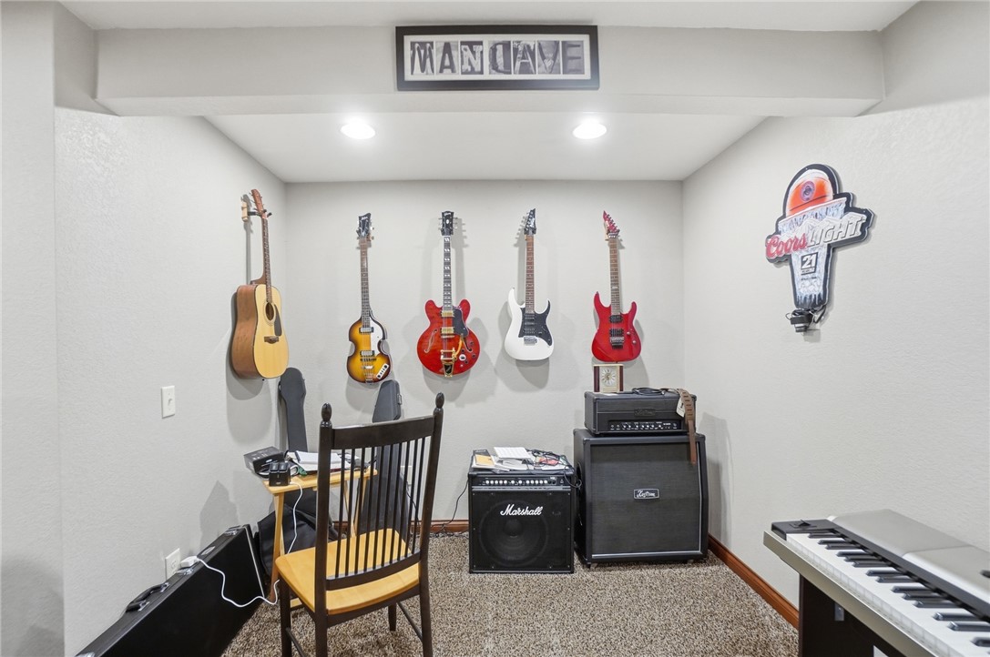5300 Brookshire Lane Springfield, OH 45502 - Photo 50 of 56 This versatile room features carpet flooring and recessed lighting, perfect for various activities.