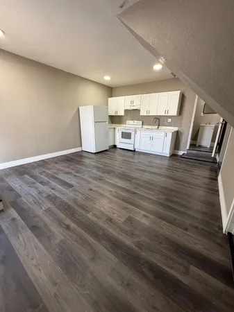a view of kitchen and wooden floor
