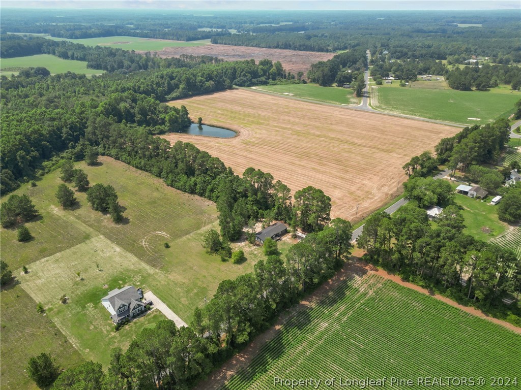 8002 Fayetteville Road Godwin, NC 28344 - Photo 6 of 40 an aerial view of a house with a yard