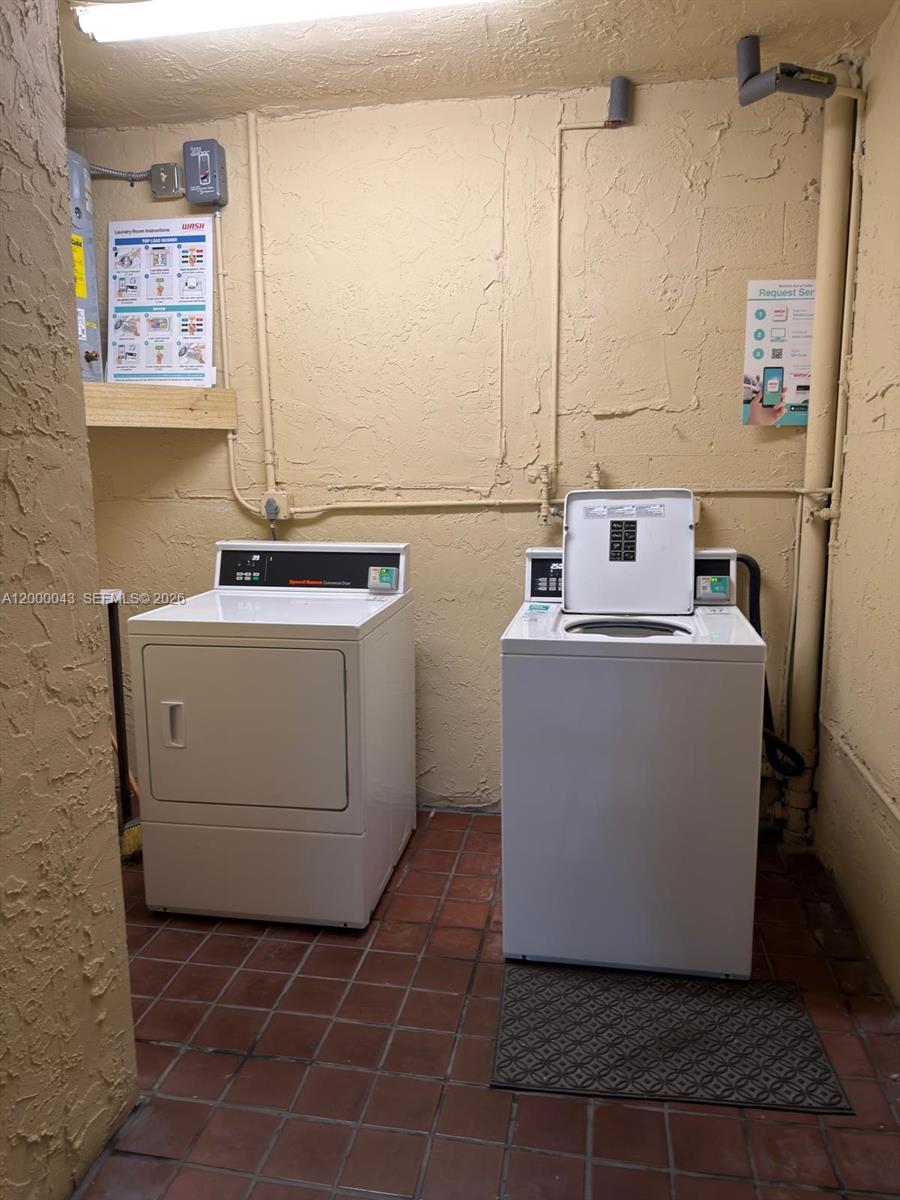 9108 Southwest 137th Street, Unit 163 Miami, FL 33176 - Photo 9 of 16 a utility room with a washer and dryer