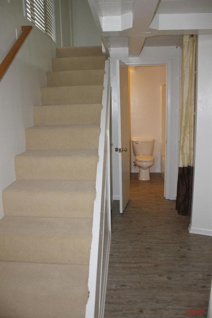 77 Depot Road Montecito, CA 93108 - Photo 8 of 14 a view of a hallway with wooden floor and a bathroom