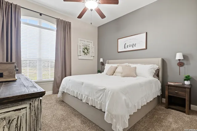 a bedroom with bed and window