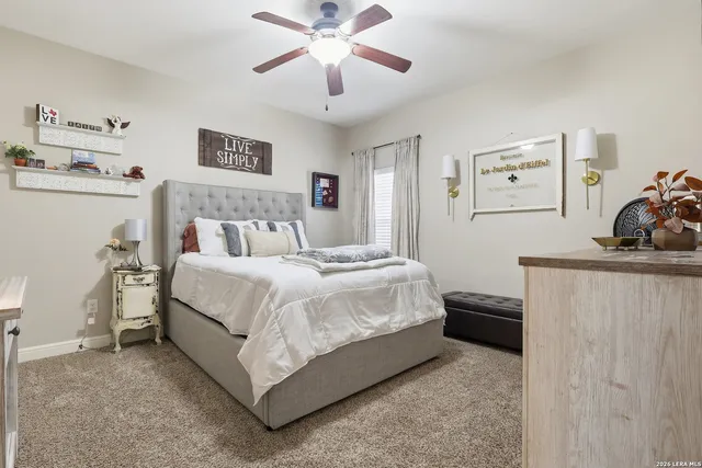 a bedroom with a bed and a dresser