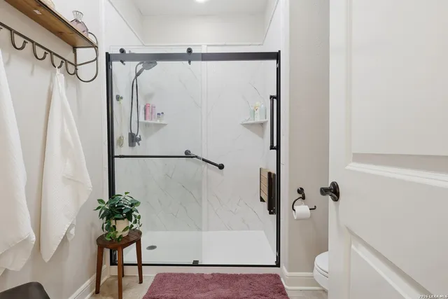 a bathroom with a shower and a tub