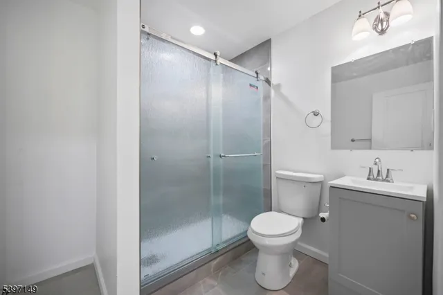 a bathroom with a toilet sink and a shower