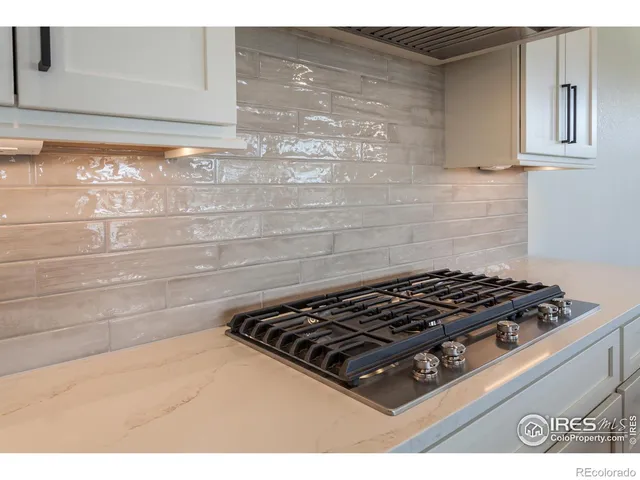 a close view of a stove a microwave and cabinets