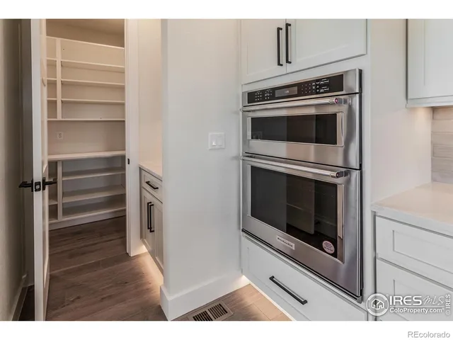 a kitchen with a stove and a microwave