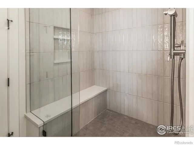 a bathroom with a shower and a toilet