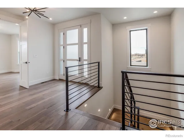 a view of entryway with wooden floor