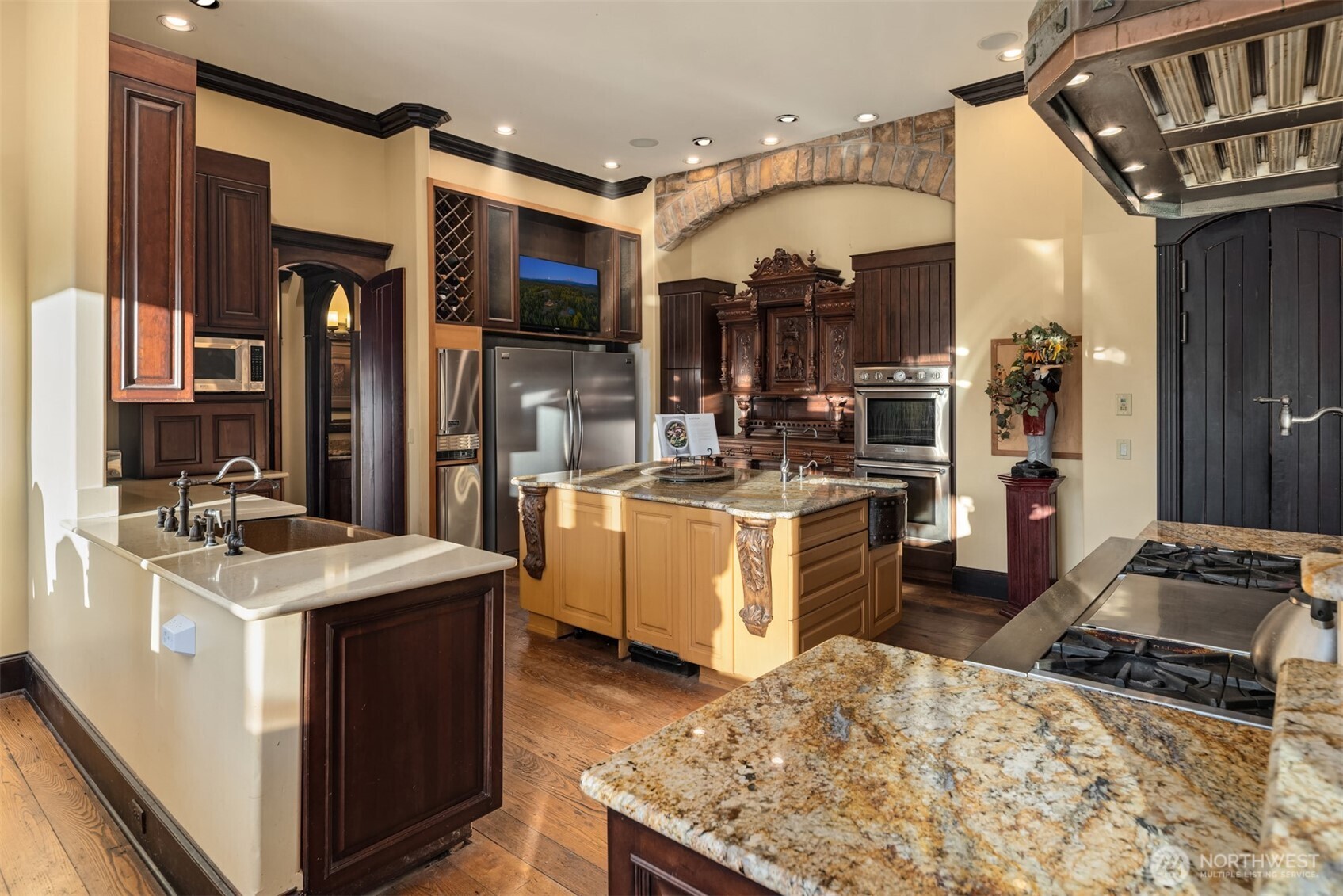 Undisclosed Address Roy, WA 98580 - Photo 23 of 40 a kitchen that has a lot of cabinets in it and wooden floors