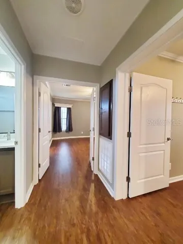 a view of gallery with wooden floor