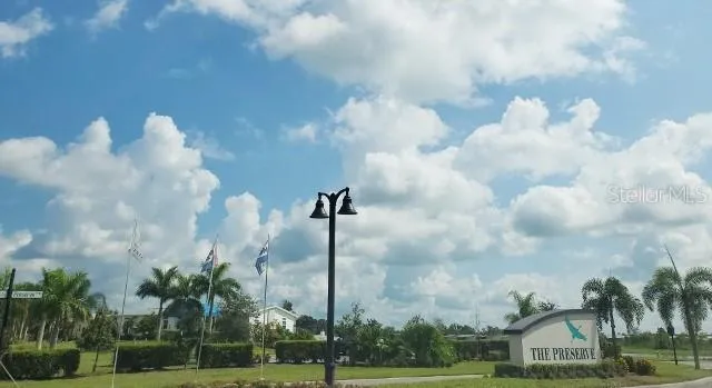 a front view of a multi story residential apartment building with a yard