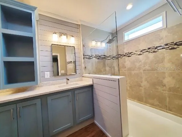 a bathroom with a double vanity sink and mirror
