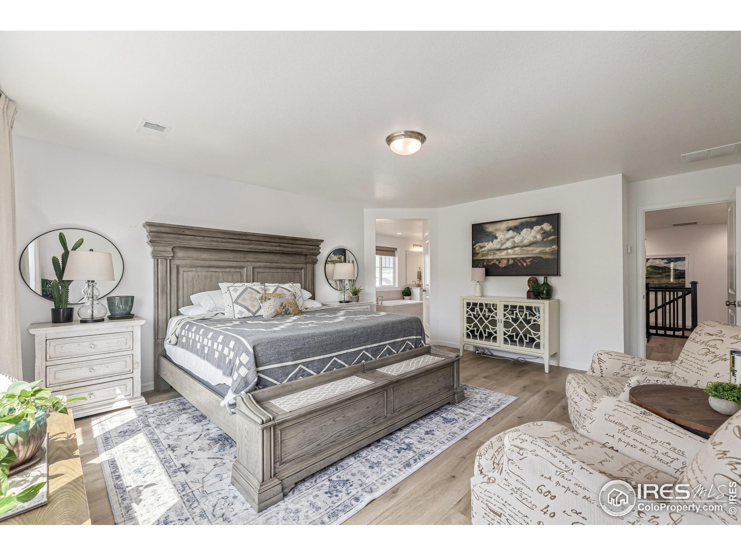 3624 Rucksack Court Castle Rock, CO 80108 - Photo 28 of 50 a bedroom with a bed a mirror and lamp