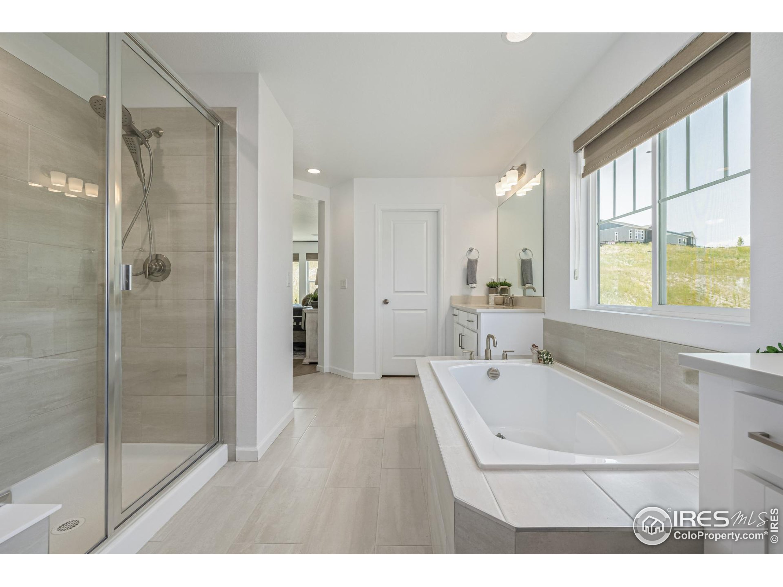 3624 Rucksack Court Castle Rock, CO 80108 - Photo 32 of 50 a bathroom with a bathtub and a shower