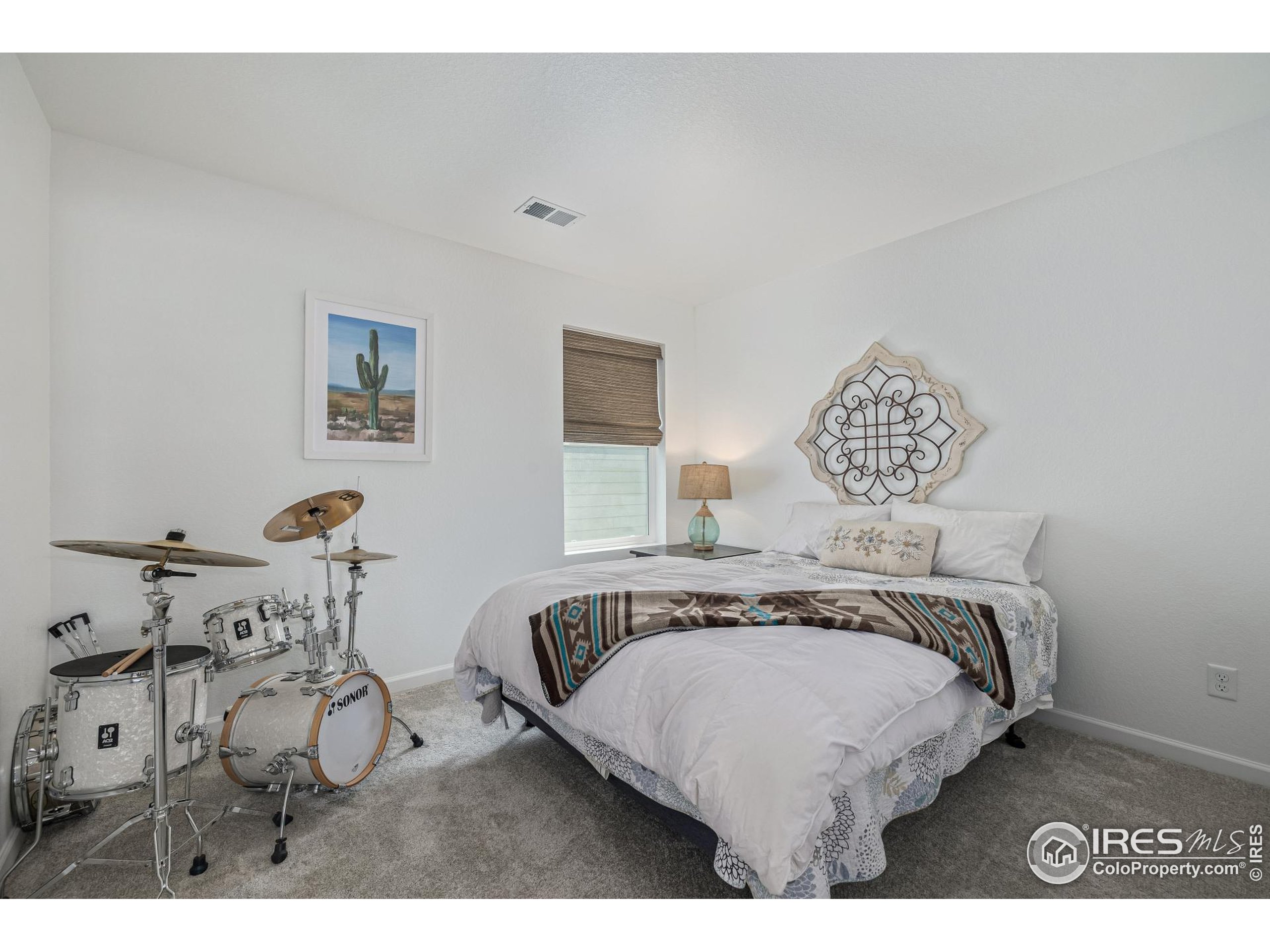 3624 Rucksack Court Castle Rock, CO 80108 - Photo 37 of 50 a bedroom with a bed and a table in it