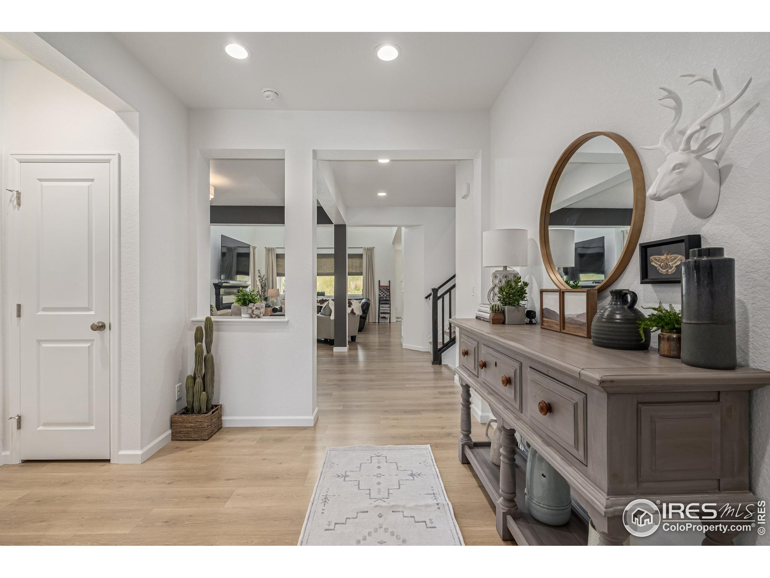3624 Rucksack Court Castle Rock, CO 80108 - Photo 4 of 50 a living room with furniture and a view of kitchen