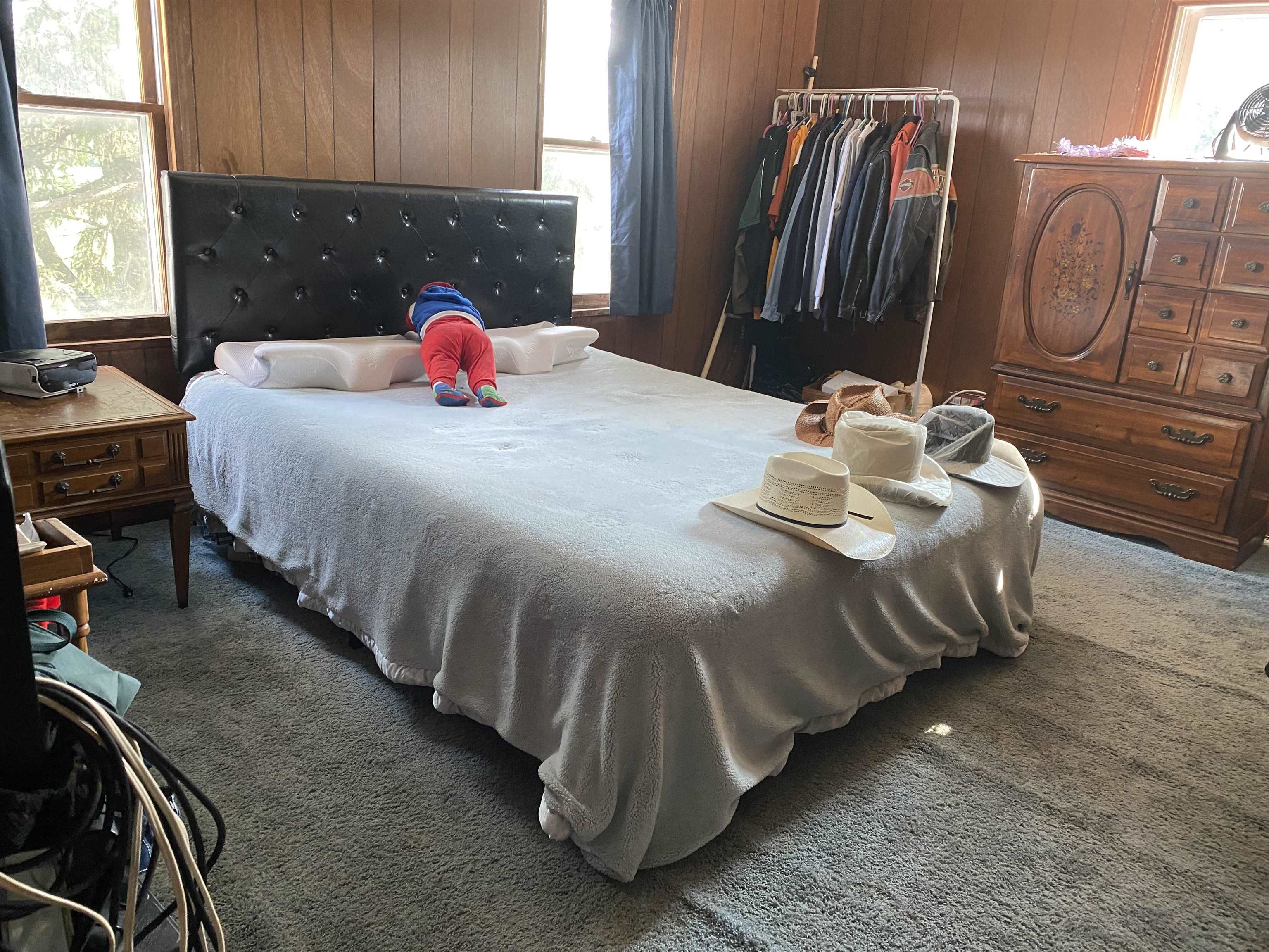 3848 West Yoder Road Freeport, IL 61032 - Photo 12 of 12 a bedroom with a bed and dresser with mirror