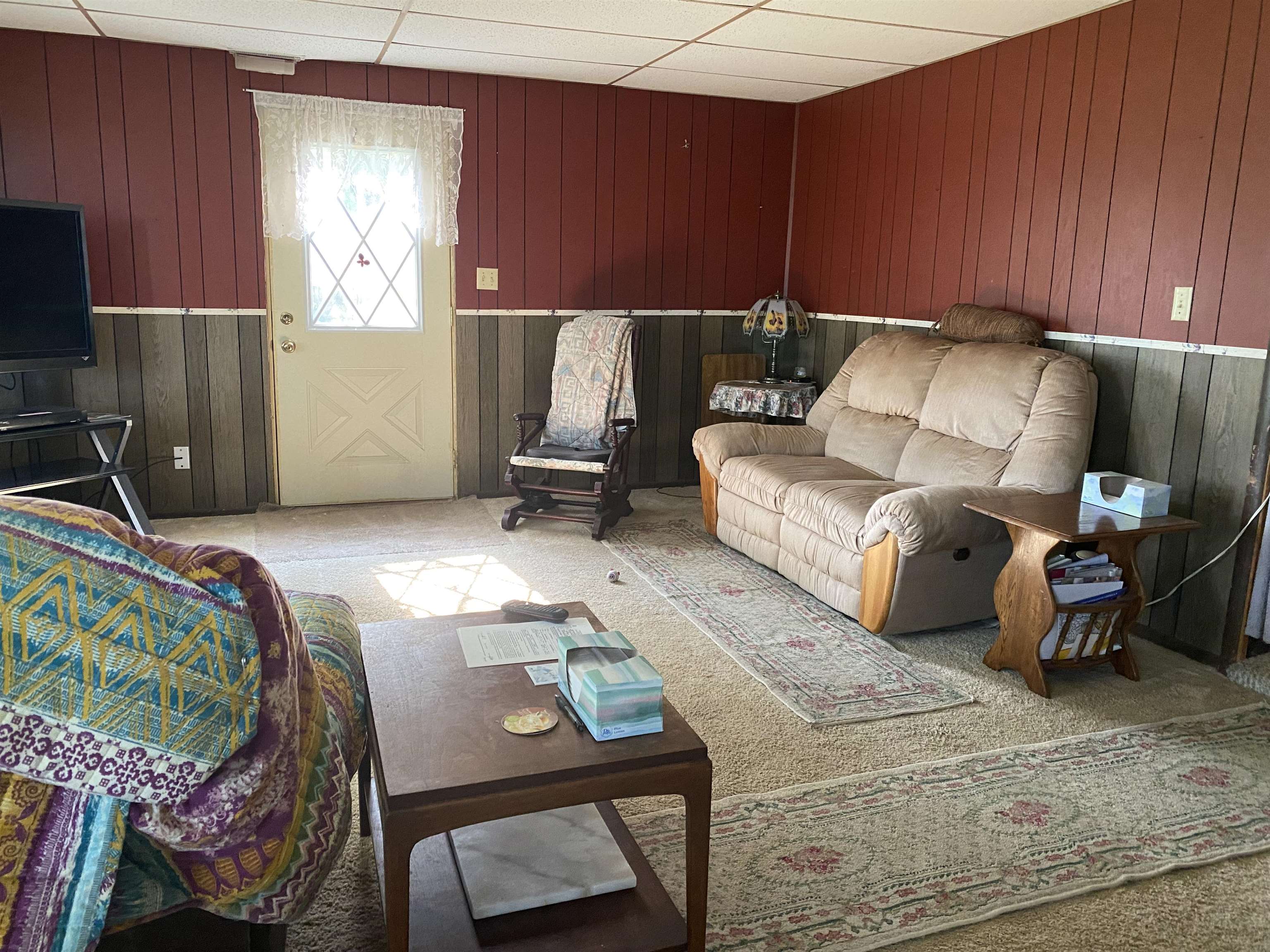 3848 West Yoder Road Freeport, IL 61032 - Photo 5 of 12 a living room with furniture a couch and a fireplace