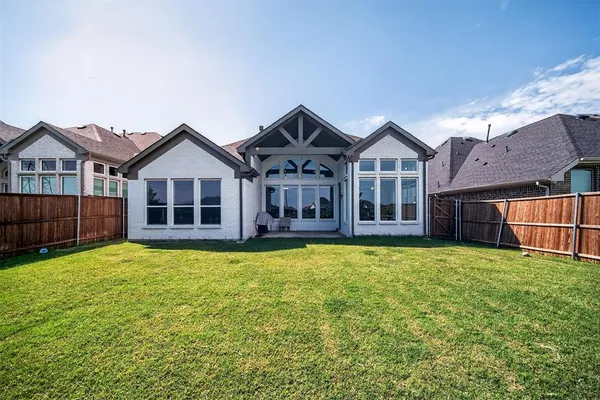 a front view of a house with yard