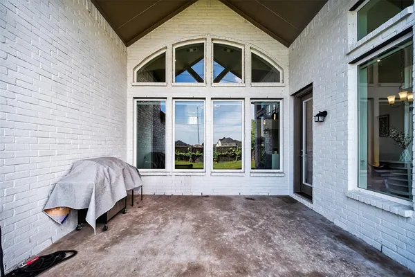 a view of an house with backyard and porch