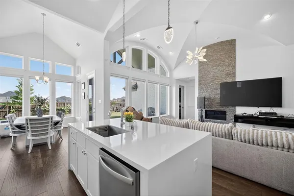 a view of living room kitchen with furniture and a flat screen tv