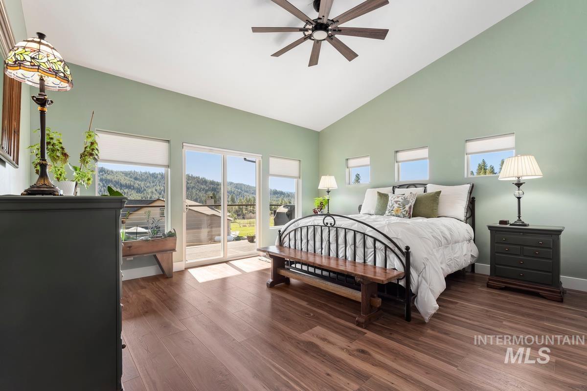 21 Open Road Garden Valley, ID 83622 - Photo 23 of 49 Bedroom with access to outside, wood finished floors, ceiling fan, multiple windows, and lofted ceiling