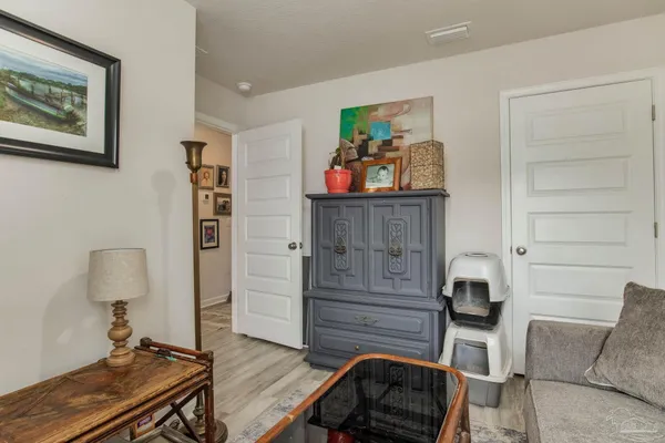 a bedroom with a bed and a bookshelf