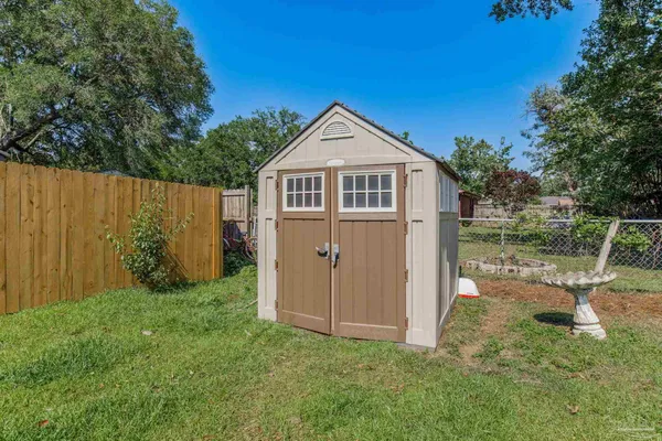a front view of house with yard and seating area
