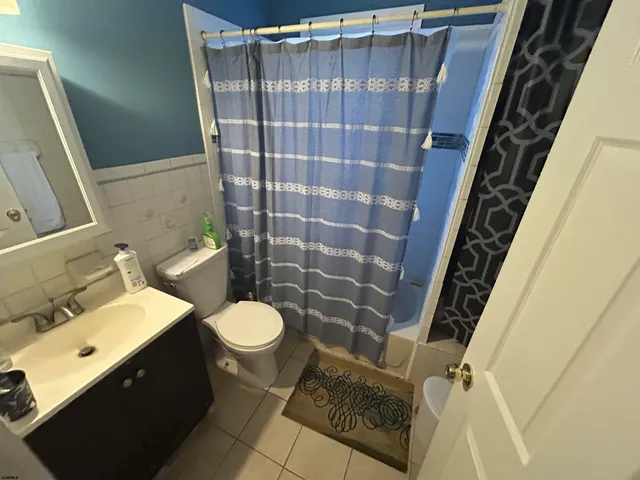 a bathroom with a sink and toilet