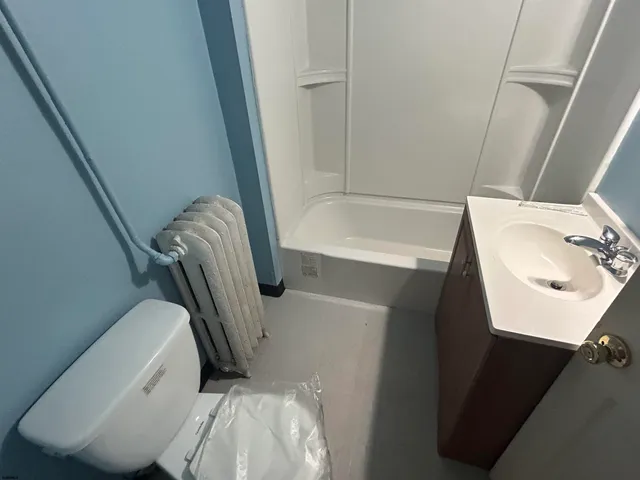 a bathroom with a sink and toilet