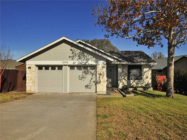a view of a house with large windows