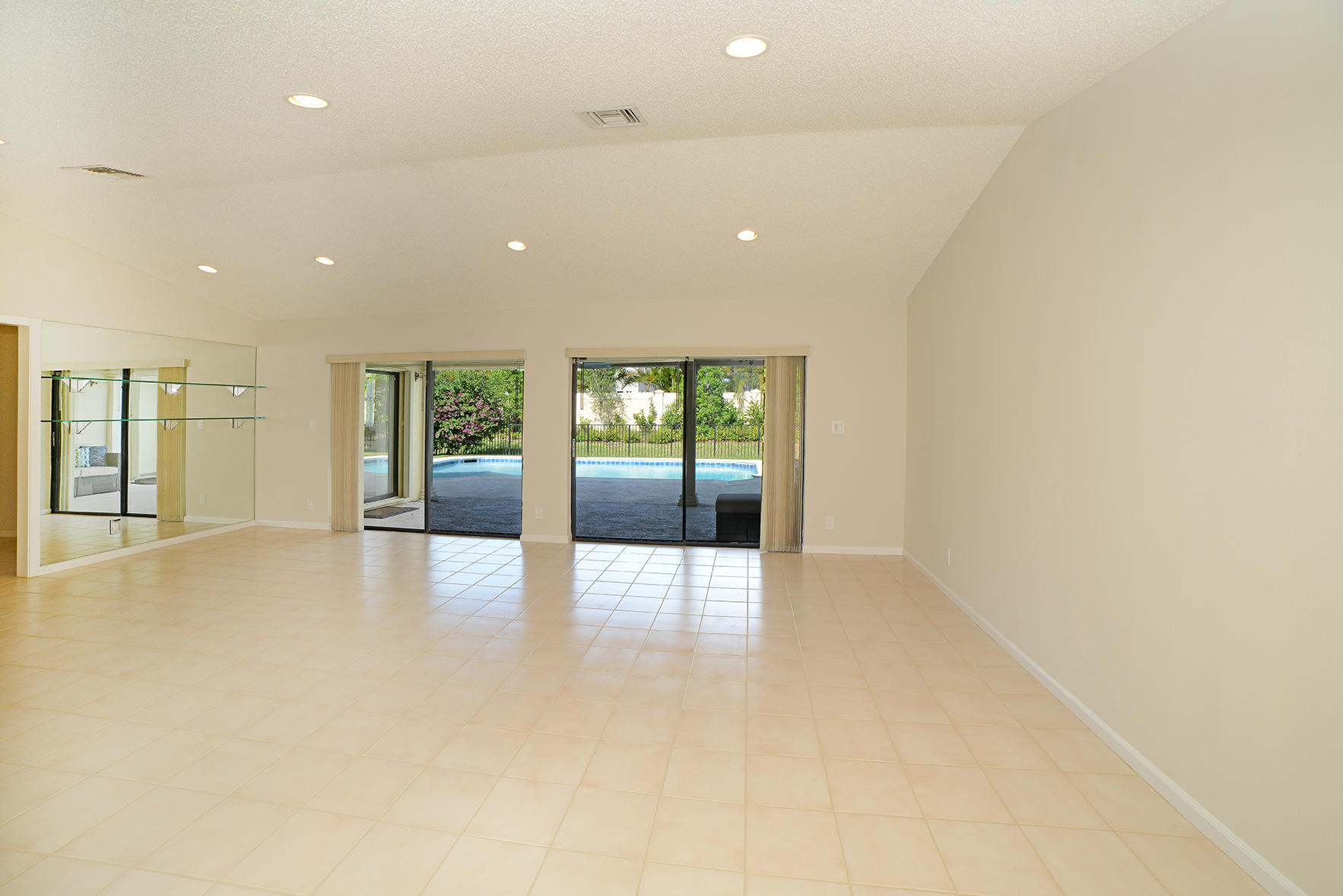 9053 Old Pine Road Boca Raton, FL 33428 - Photo 11 of 42 an empty room with large window and wooden floor