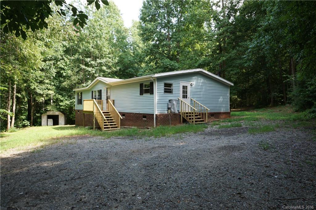 7385 Tuckaseegee Road Kannapolis, NC 28081 - Photo 1 of 14 a view of a house with a yard