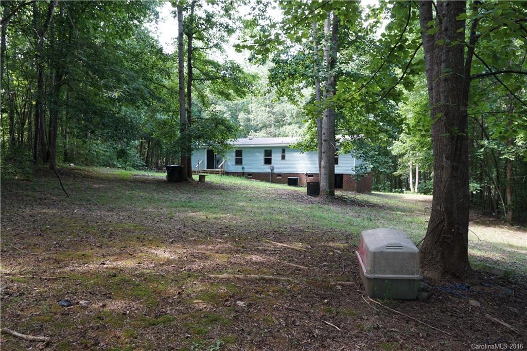 7385 Tuckaseegee Road Kannapolis, NC 28081 - Photo 13 of 14 a view of a house with a yard