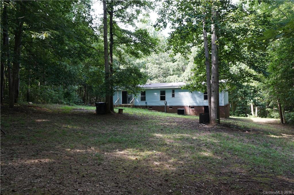 7385 Tuckaseegee Road Kannapolis, NC 28081 - Photo 14 of 14 a view of a house with a yard